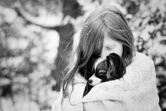 papillon puppy and girl in snow Massachusetts_dog_photography Film_photographer_NH film_photography_new_england black_and_white_photography_Massachusetts_-2